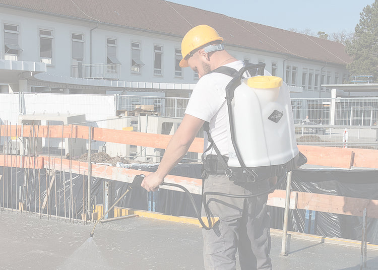 using a backpack sprayer to apply a waterproofing layer