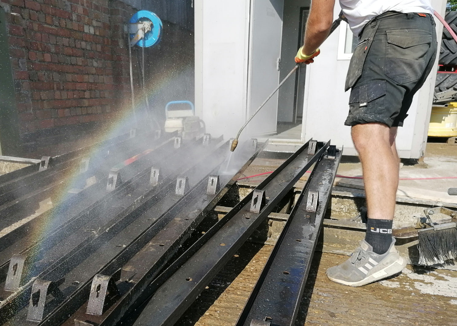 release agent for concrete shuttering. stop cement from sticking to metal and timber shuttering. photo shows shuttering being washed.