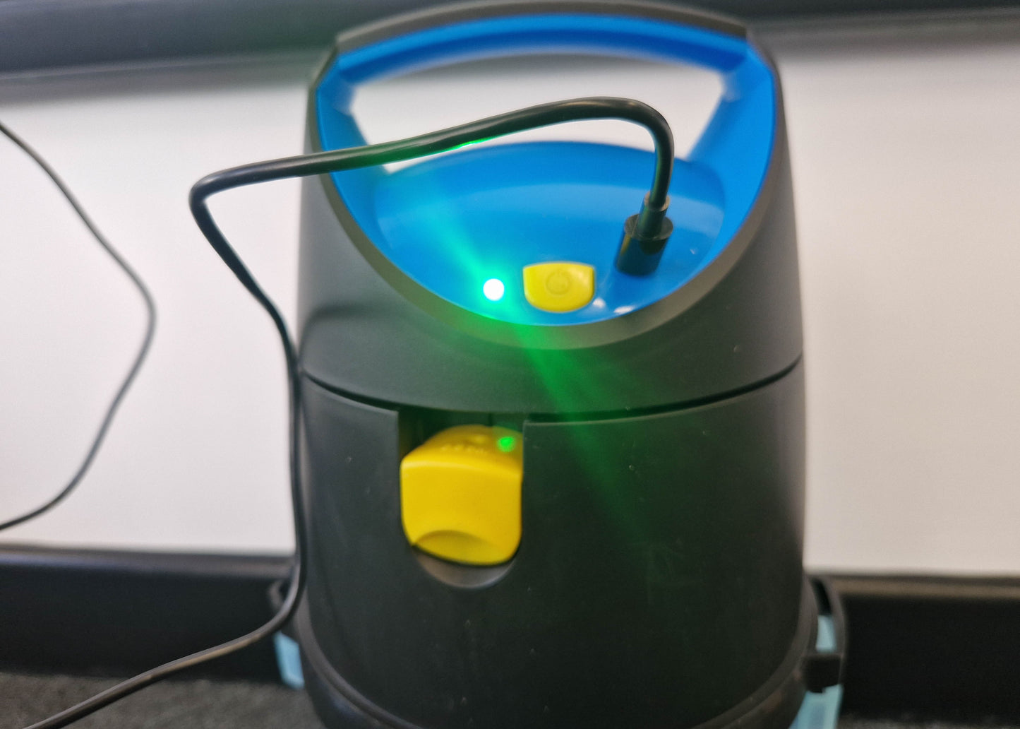 close up photo of the charging indicator light for our electric garden sprayer