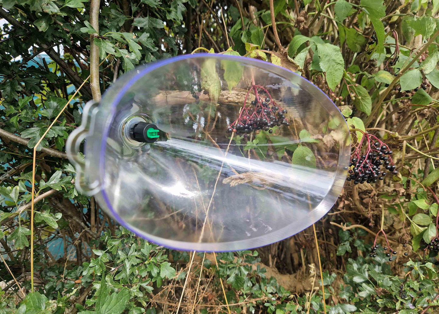 conical spray hood with nozzle to reduce drift when spraying
