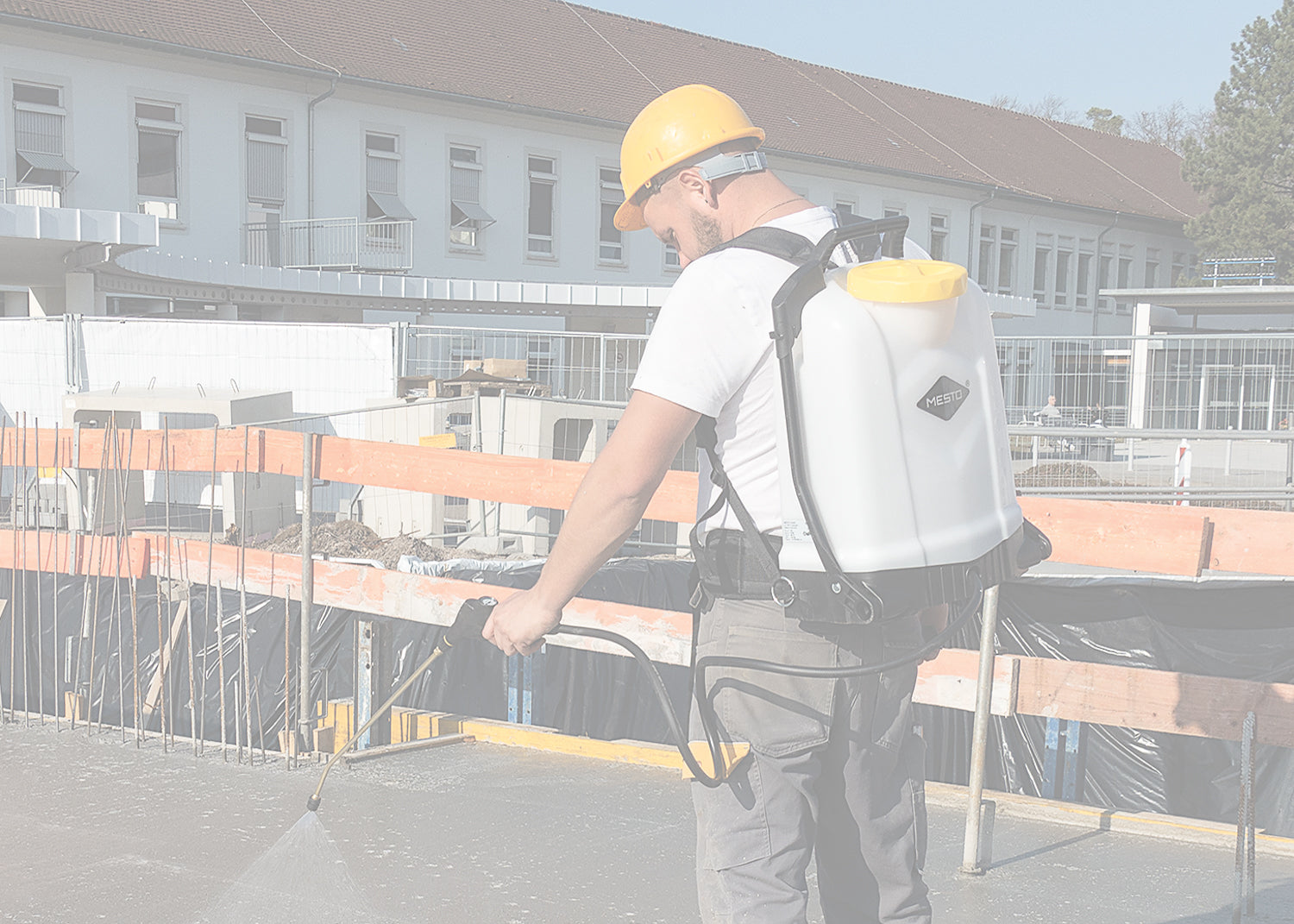 using a backpack sprayer to apply a waterproofing layer