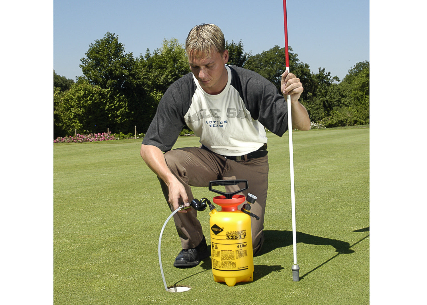 our suction tank being used to remove water from the hole on a golf course