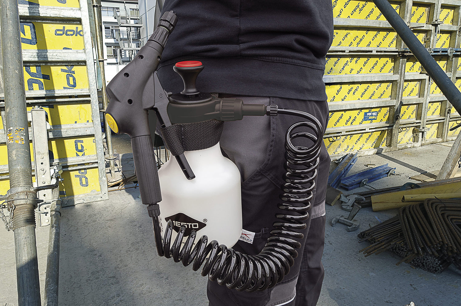 photo showing the 1.5 litre sprayer being carried on the belt of the operator